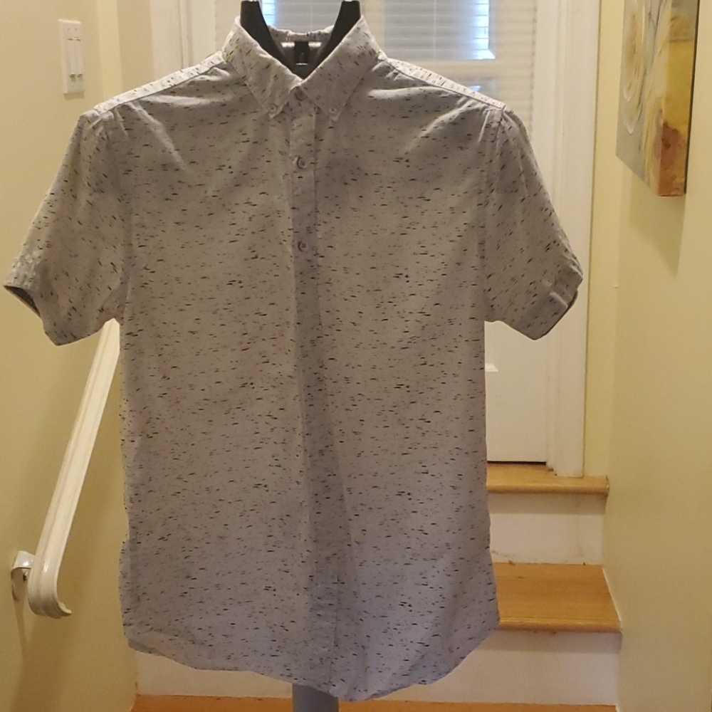 White speckled short sleeved shirt.
